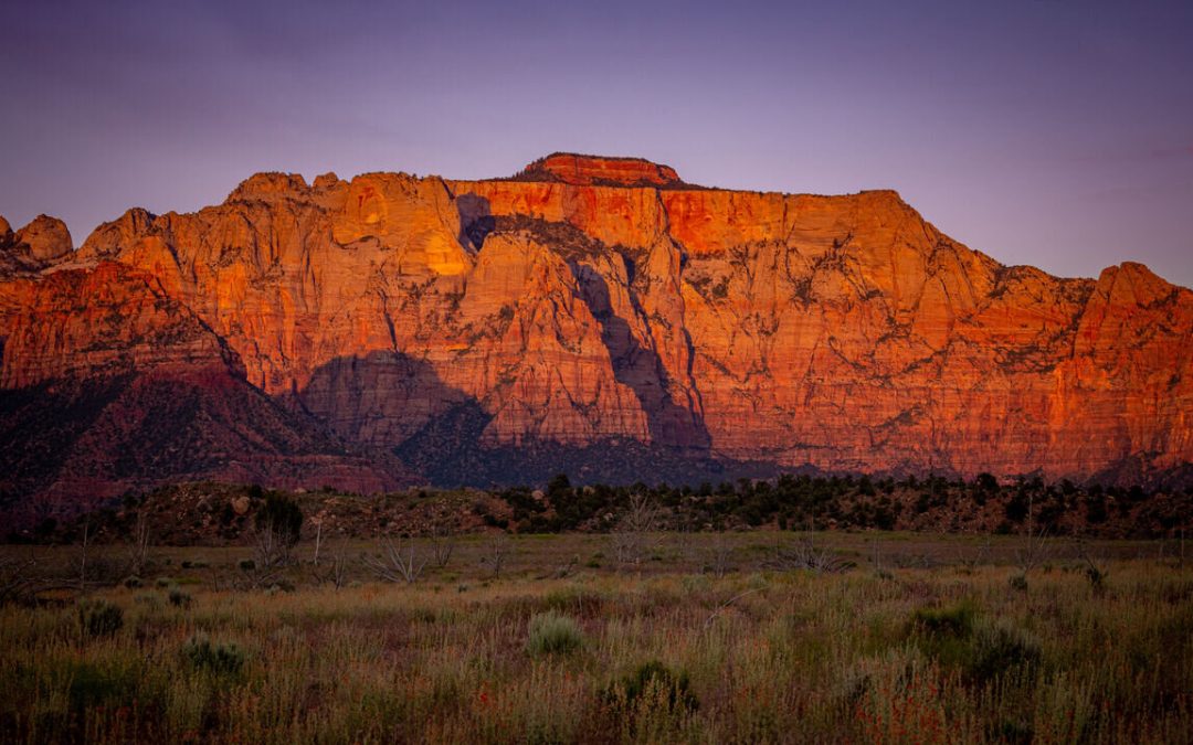 Scenic sunset view of West Temple in Zion National Park, the highest peak in the main canyon, towering over Springdale, Utah.